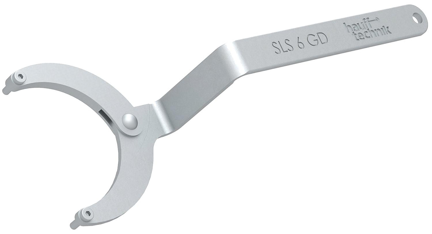 Clé à molette articulée pour le montage et le démontage des capots du système